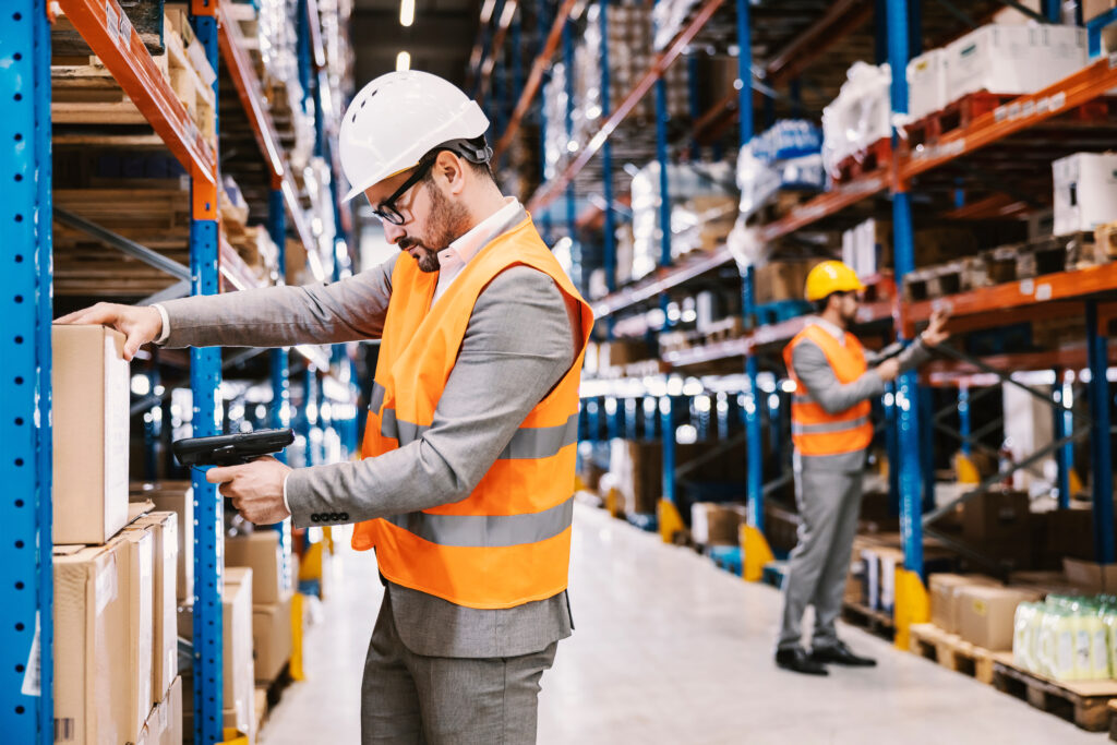 Supervisors scanning barcodes efficiently in a warehouse